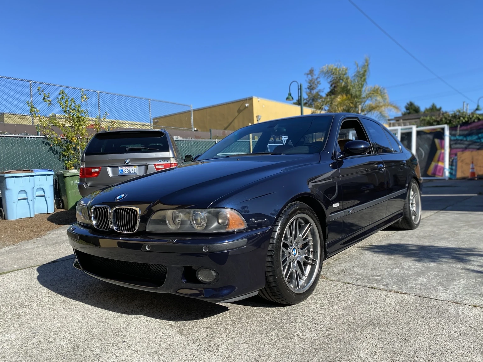 Dark blue BMW sedan in sunlight