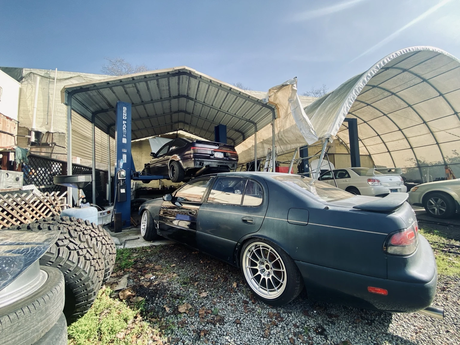 Enthusiast vehicles in a working shop environment