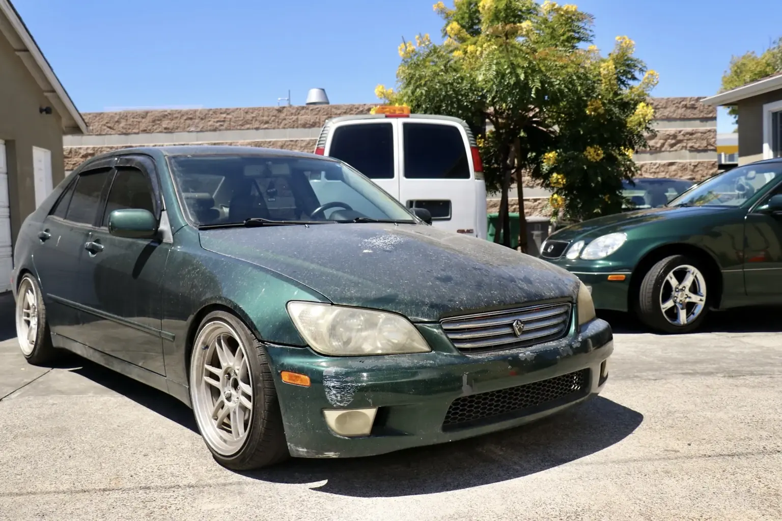 Hi-Caliber Culture Vault before photo of a green Lexus IS300