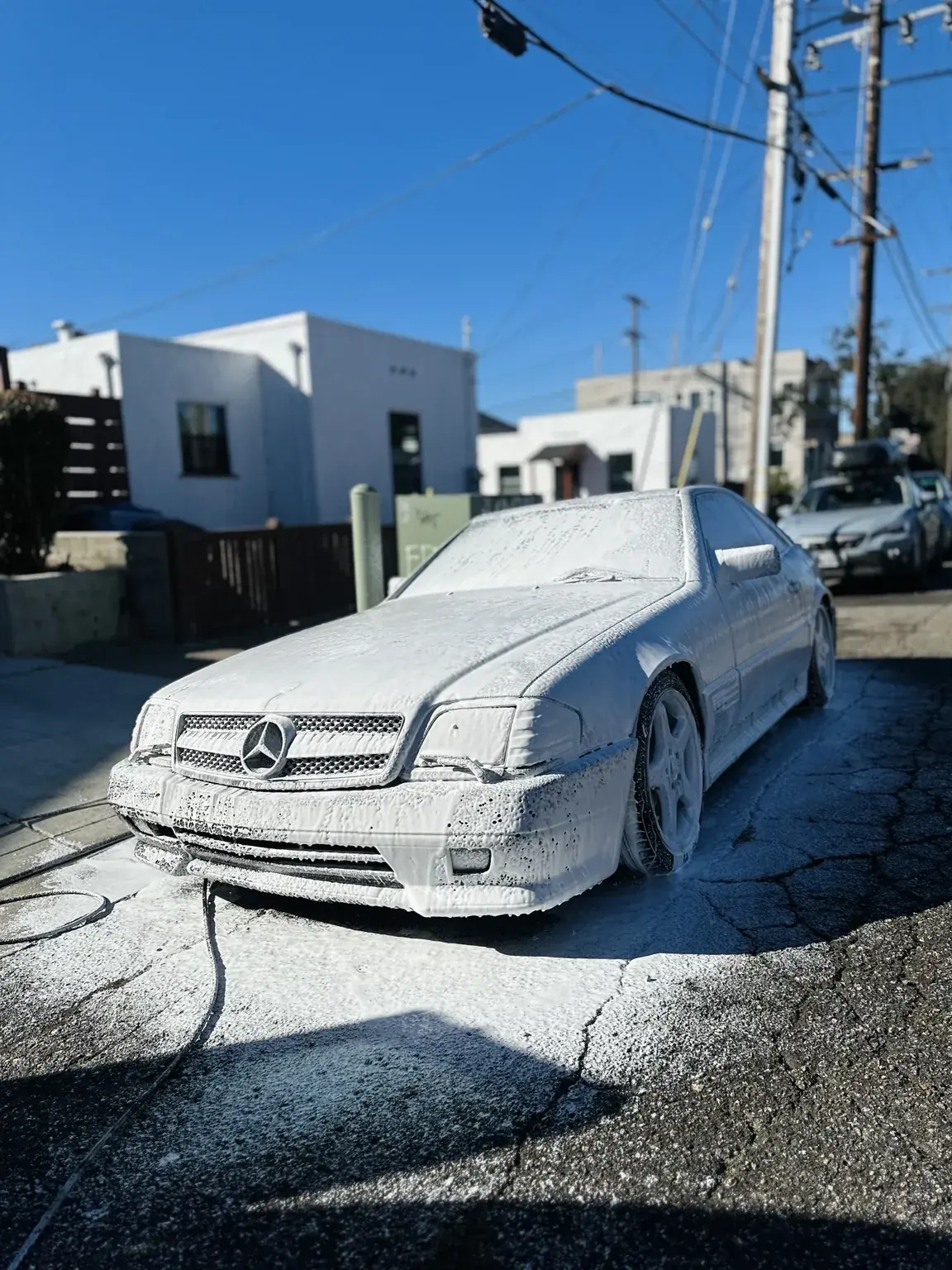 Mercedes receiving a foam wash as part of Hi-Caliber maintenance care